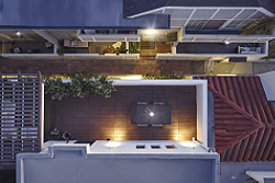 High-end real estate photography birds eye drone view over a condo deck in West Hollywood, CA. by Tom Hunter Photography